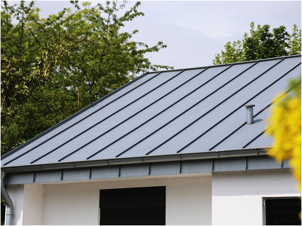 Standing seam metal roof on a modern white building