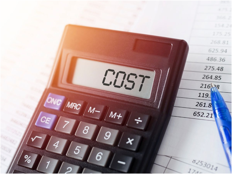 Calculator showing cost beside financial document
